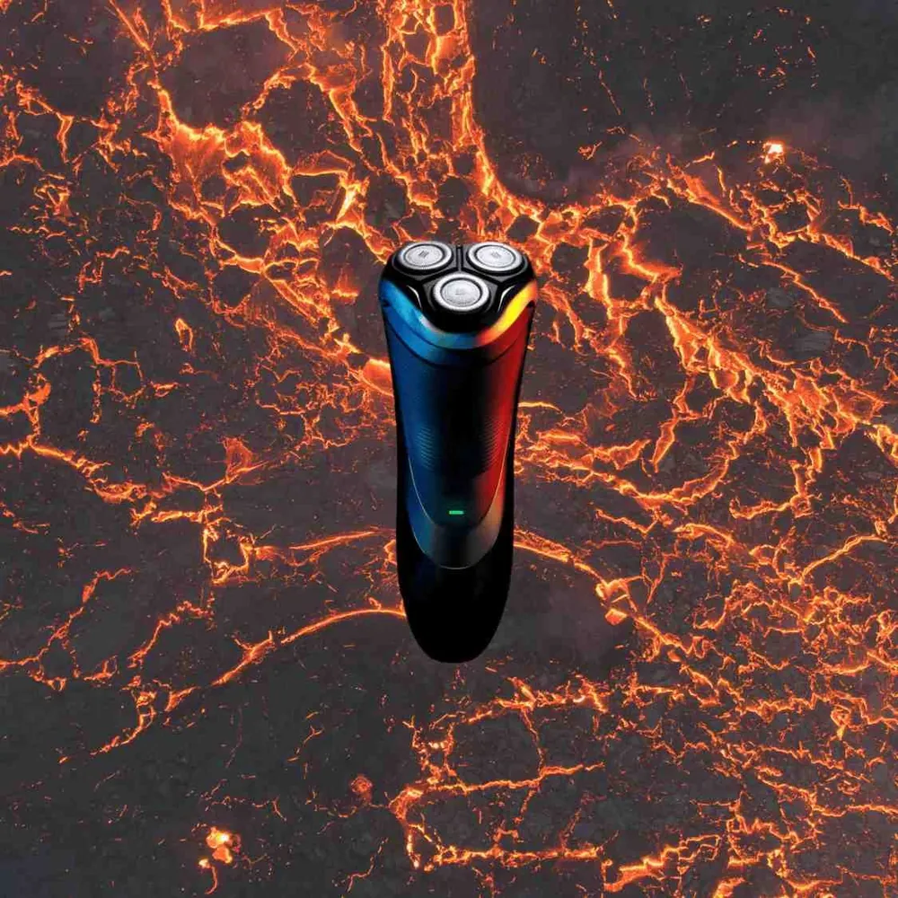 Rasoir électrique sur fond de lave — métaphore de la chaleur